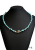 Collar bohemio con concha dorada de colores azules