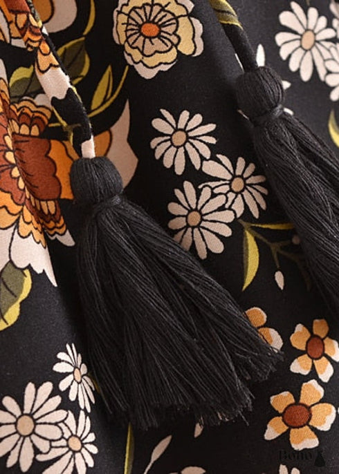 Faldas bohemias con estampado Maryam de flores negras y doradas para mujer