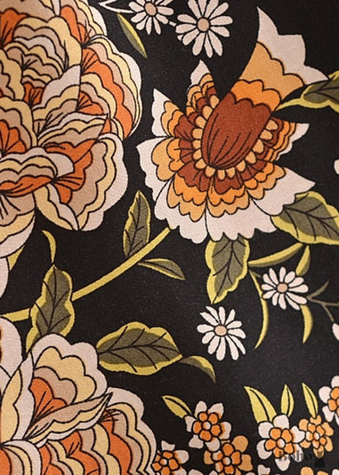 Faldas bohemias con estampado Maryam de flores negras y doradas para mujer