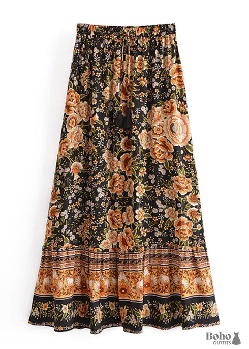 Faldas bohemias con estampado Maryam de flores negras y doradas para mujer