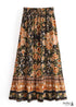 Faldas bohemias con estampado Maryam de flores negras y doradas para mujer