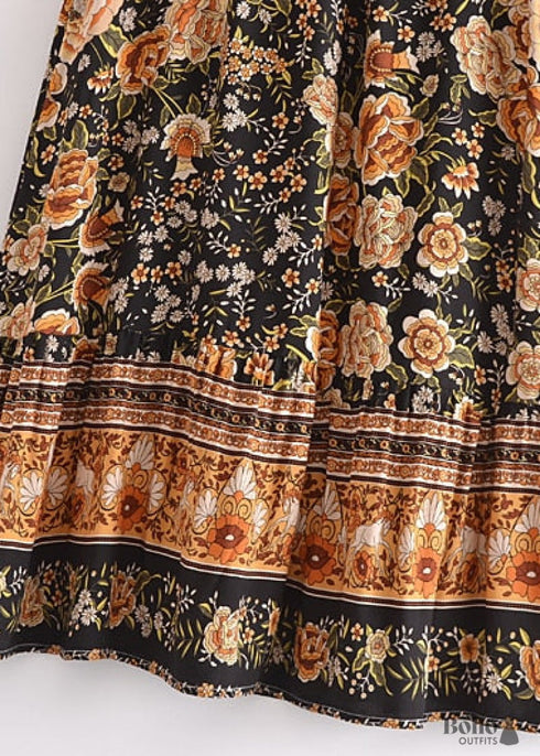 Faldas bohemias con estampado Maryam de flores negras y doradas para mujer