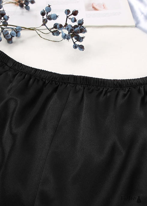 Pijama bohemio de satén Corinne en negro.