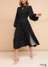 Vestido negro de manga larga con lunares